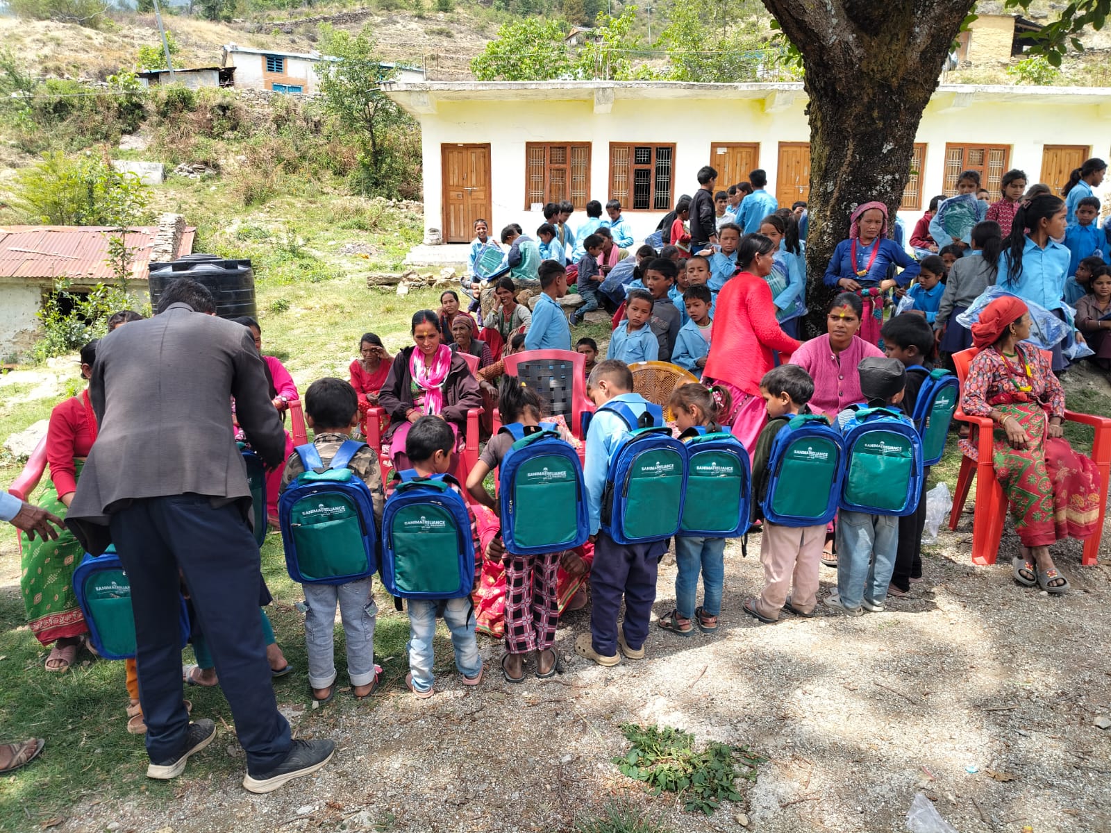 Sanima Reliance Life distributes bags to students in Bajura