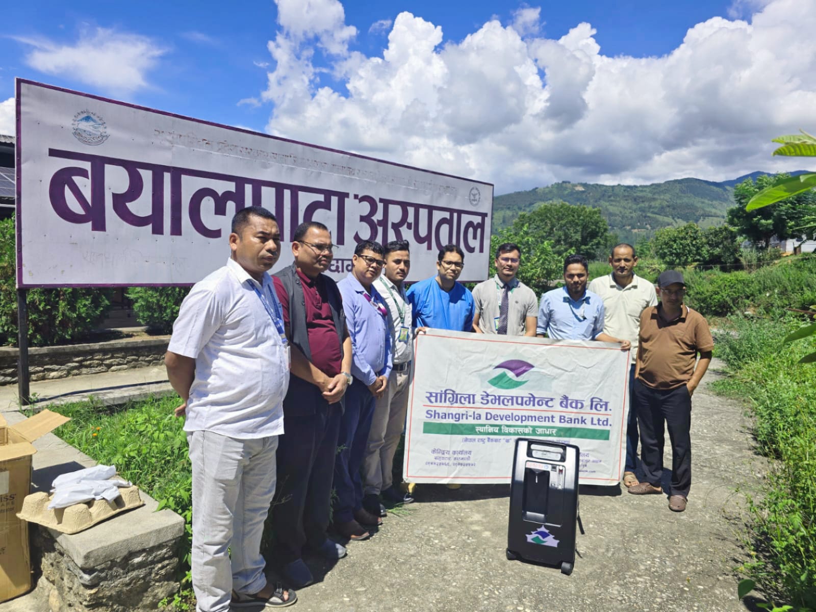 Shangri-La Development Bank hands over oxygen concentrators to Bayalpata Hospital