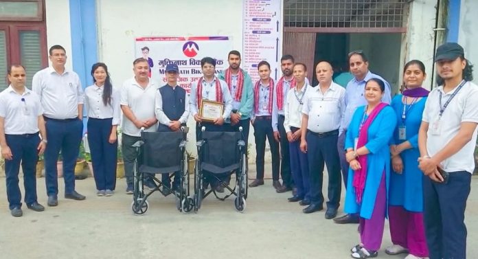 Muktinath Bikas Bank provides wheelchairs to various institutions